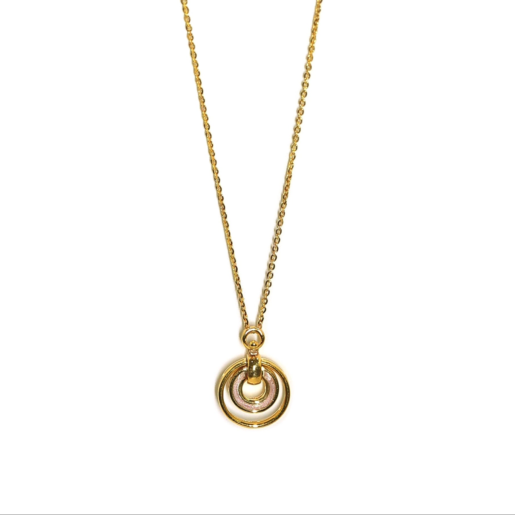 Gold necklace with a circular pendant on a white background