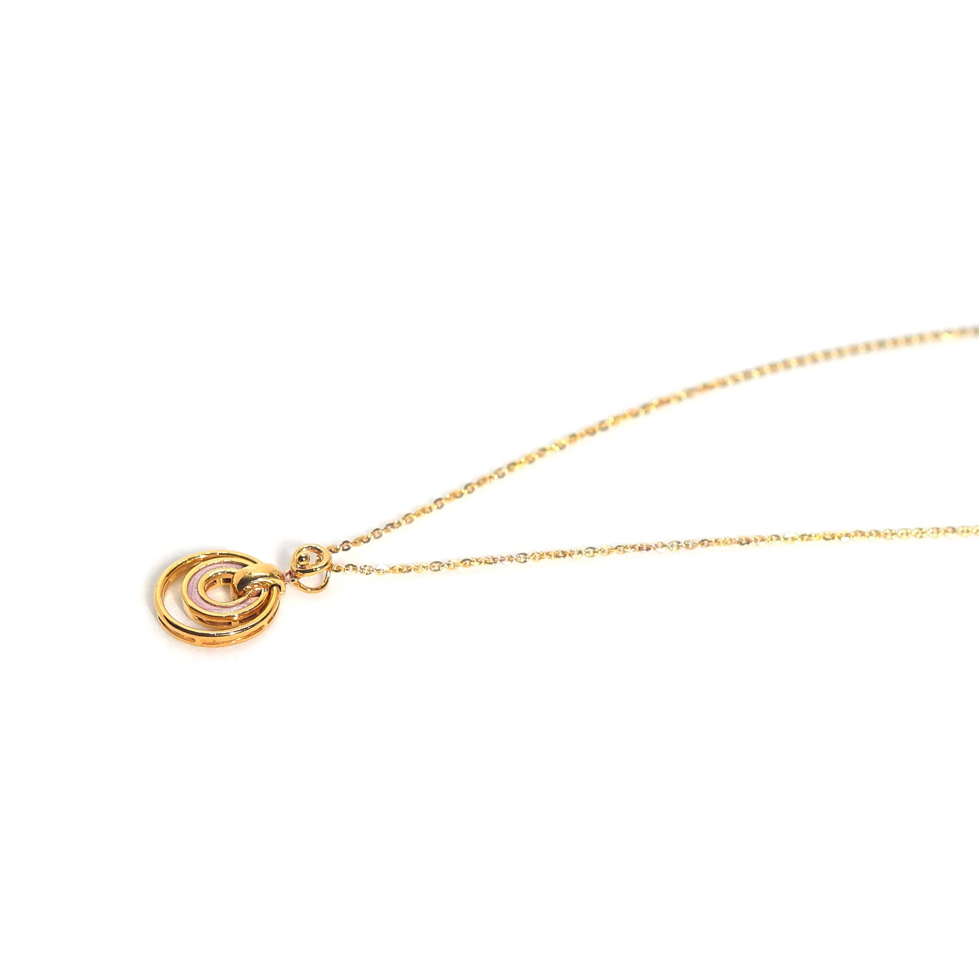 Gold necklace with a circular pendant on a white background