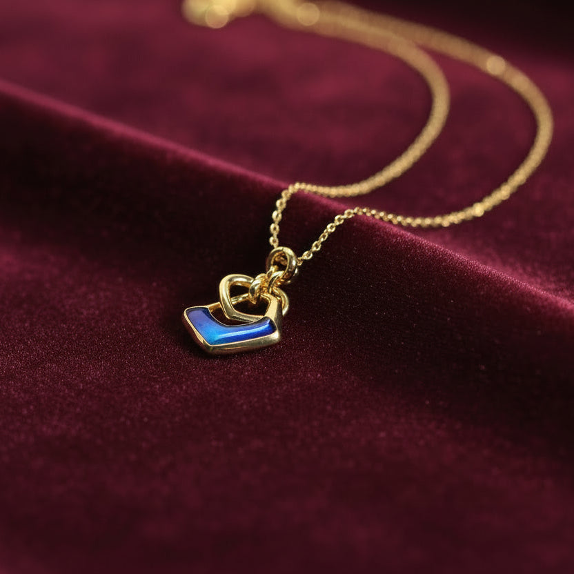 Midnight embrace gold pendant necklace