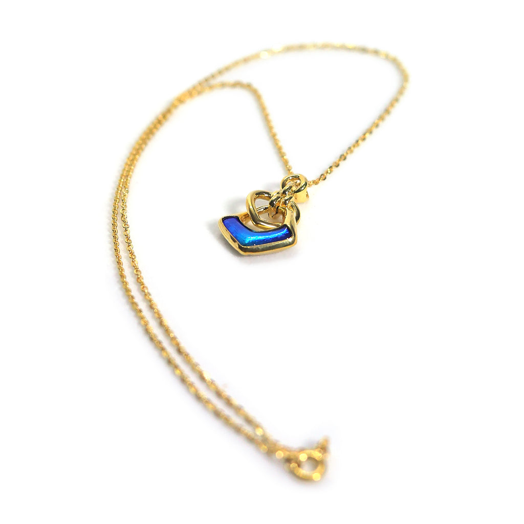Midnight embrace gold pendant necklace
