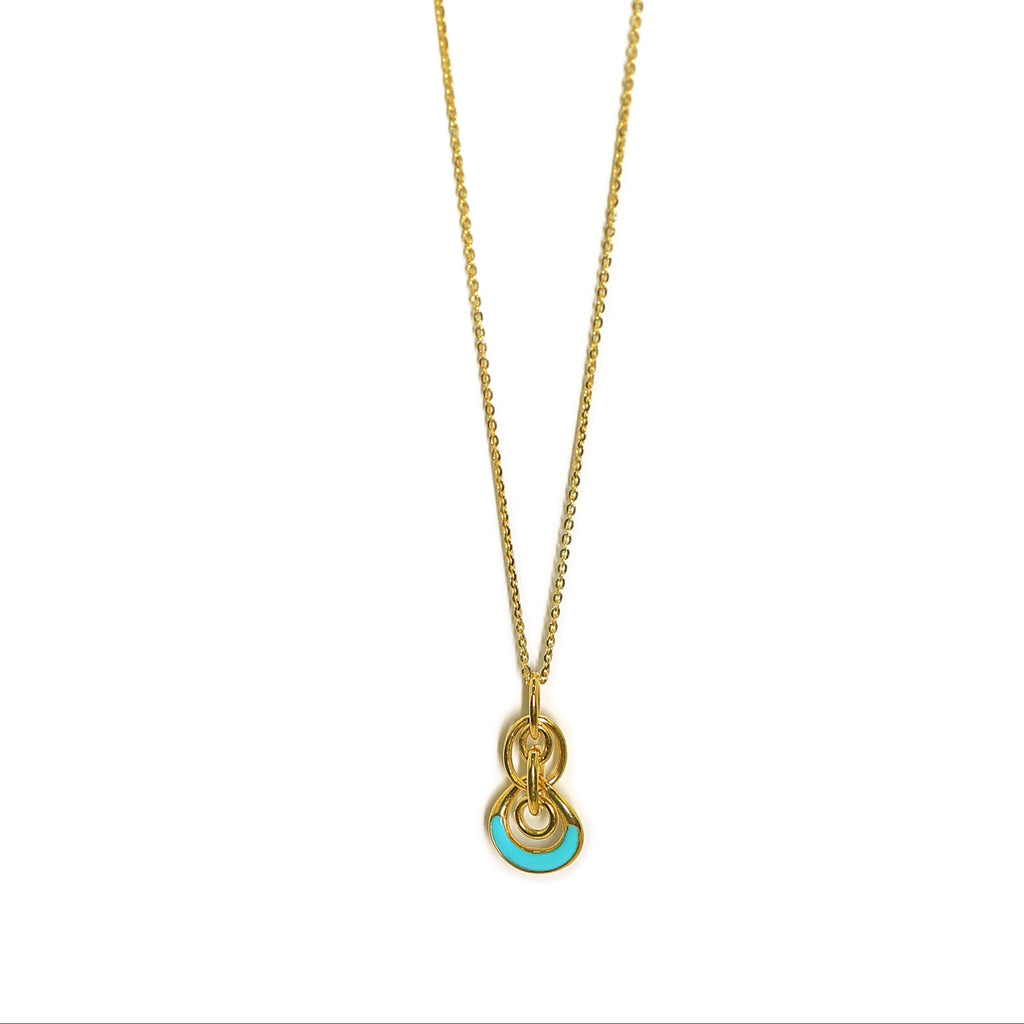 Gold necklace with a pendant on a white background